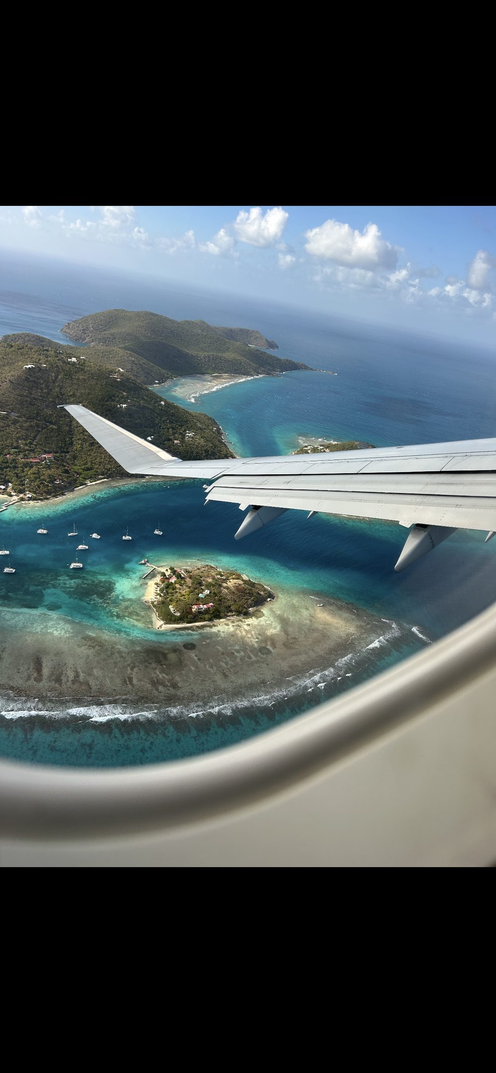 Turquoise islands seen from an airplane window